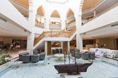 Hotel lobby with grand staircase at El Mouradi Mahdia
