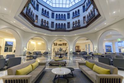 Lobby lounge under a glass dome at El Mouradi Gammarth Lobby lounge under a glass dome at El Mouradi Gammarth