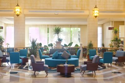 Hotel lobby lounge with seating at El Mouradi Hammamet