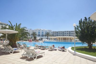 Sun loungers by the outdoor pool at El Mouradi Hammamet