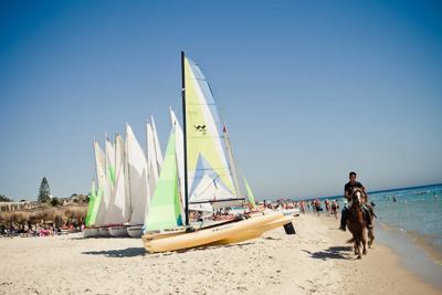 Sailing catamarans on the beach at El Mouradi Club Kantaoui