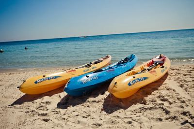 Kayaks on the sandy beach at El Mouradi Club Kantaoui