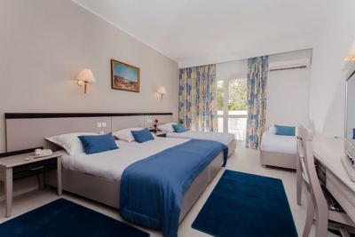 Double room with blue bedspread at El Mouradi Club Selima Double room with blue bedspread at El Mouradi Club Selima
