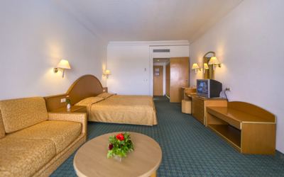 Double room with sofa and seating area at El Mouradi Skanes Double room with sofa and seating area at El Mouradi Skanes
